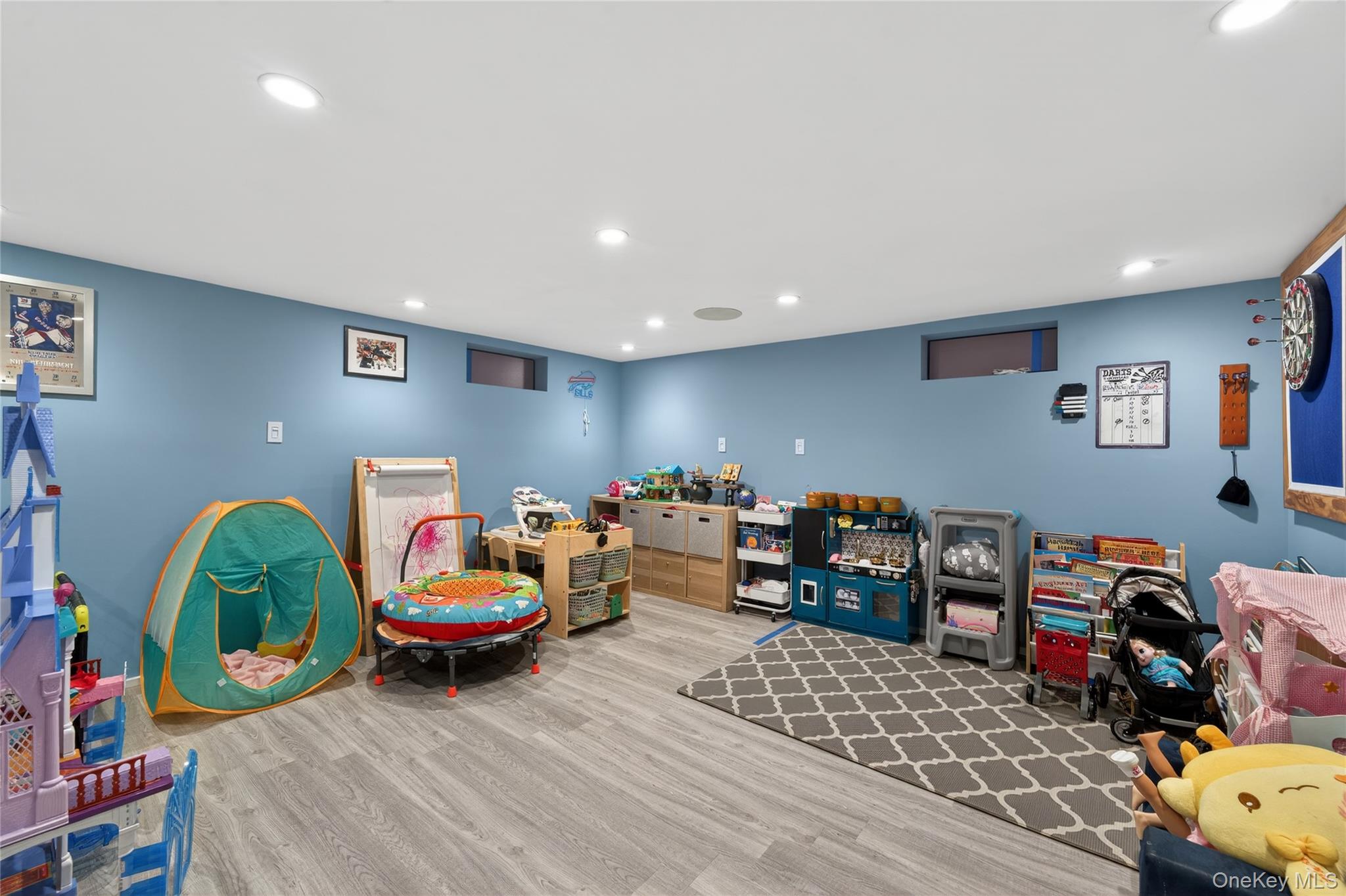 49-54 166th Street Queens, NY 11365 - Photo 36 of 41 a bedroom with furniture and a wooden floor