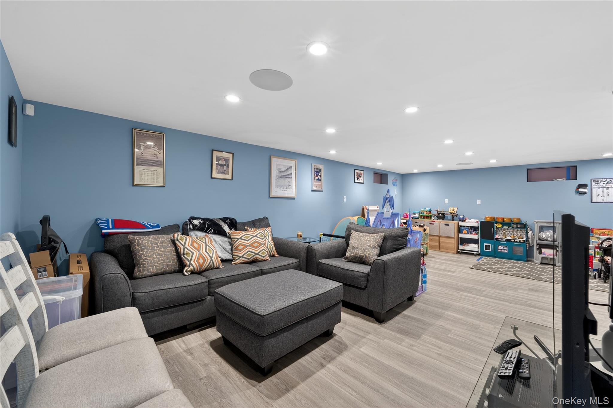 49-54 166th Street Queens, NY 11365 - Photo 38 of 41 a living room with furniture and a wooden floor