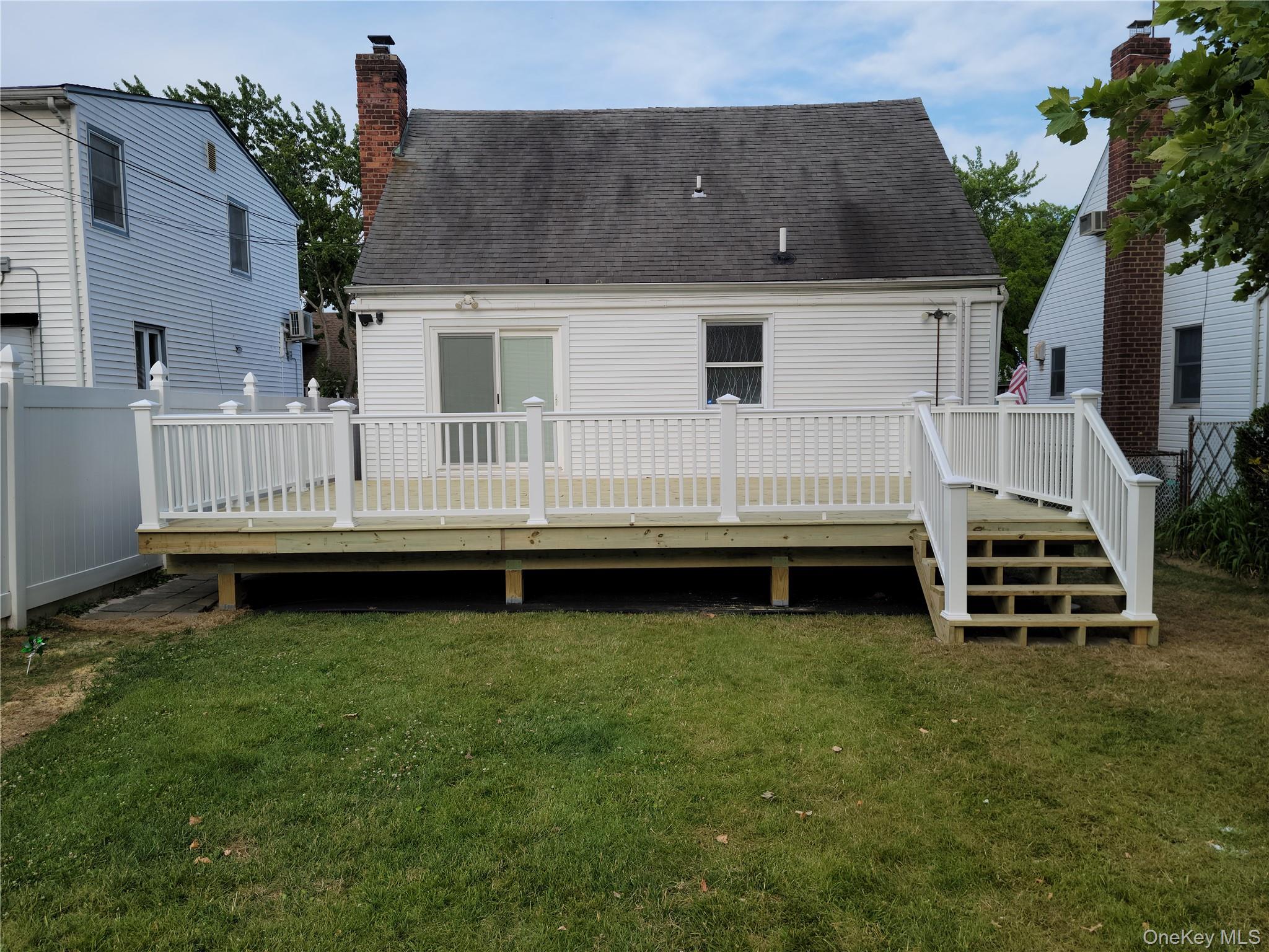 49-54 166th Street Queens, NY 11365 - Photo 4 of 41 a view of a house with a yard