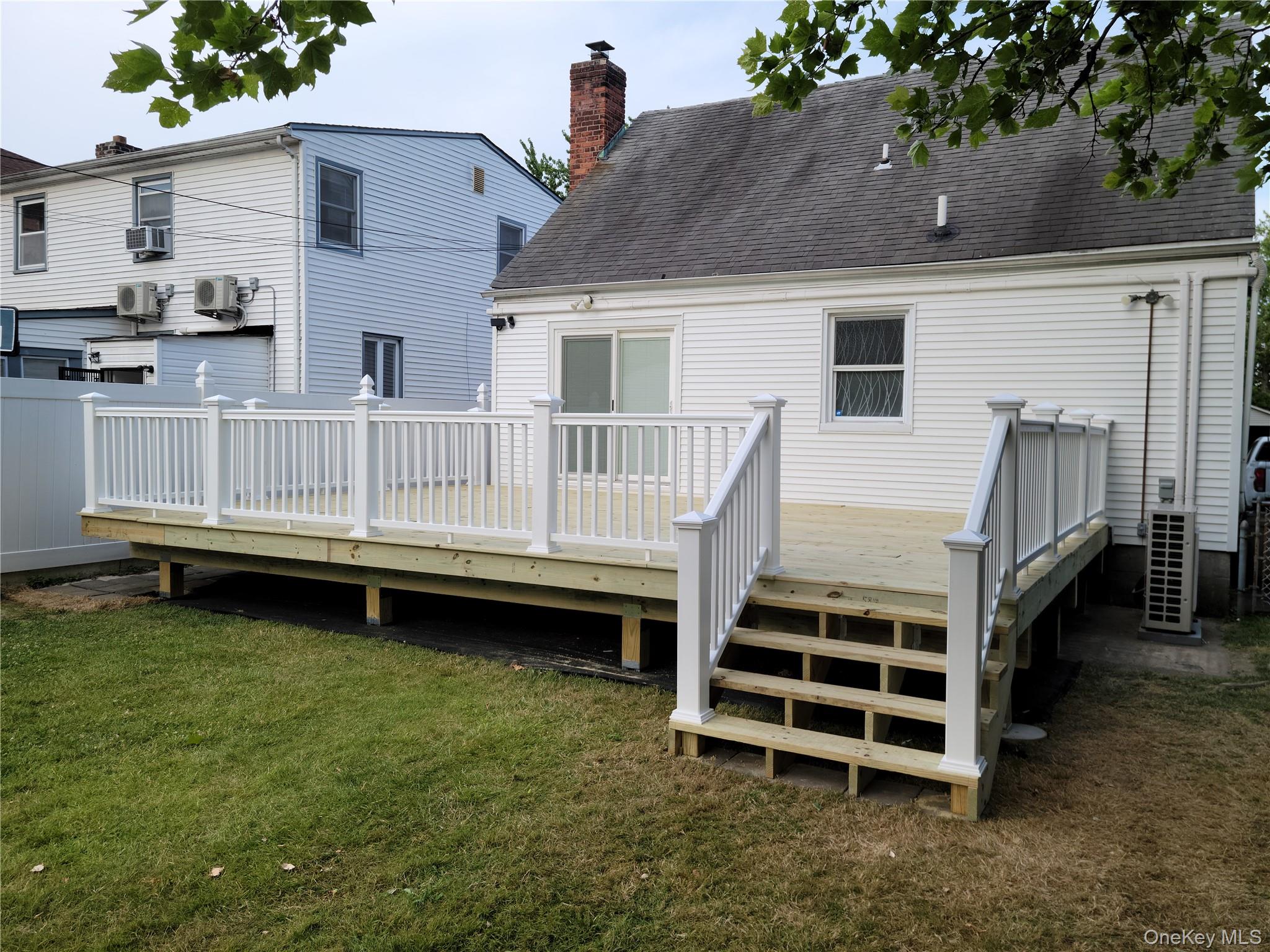 49-54 166th Street Queens, NY 11365 - Photo 5 of 41 a view of a house with a yard and sitting area