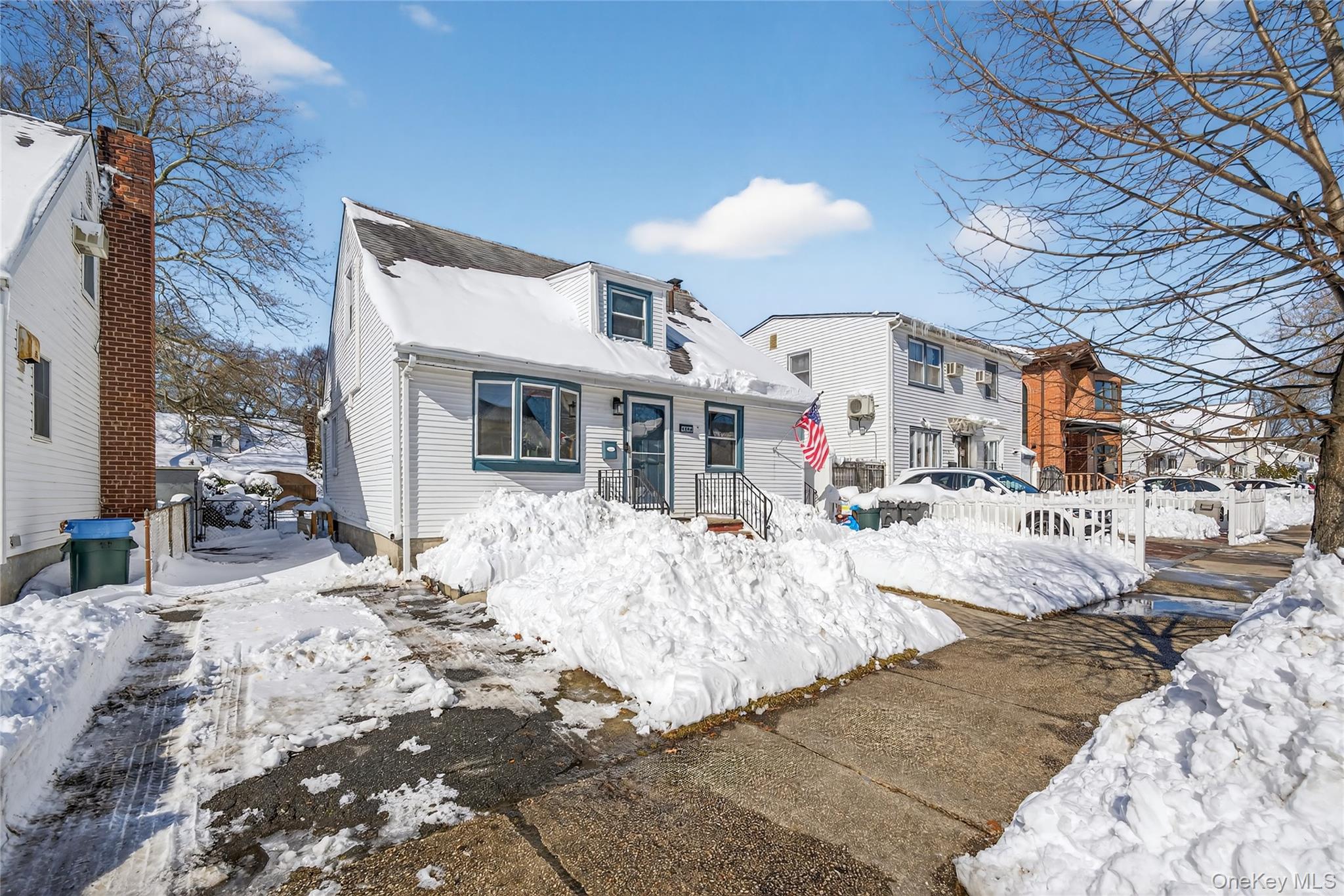 49-54 166th Street Queens, NY 11365 - Photo 6 of 41 a view of a house with snow on the road