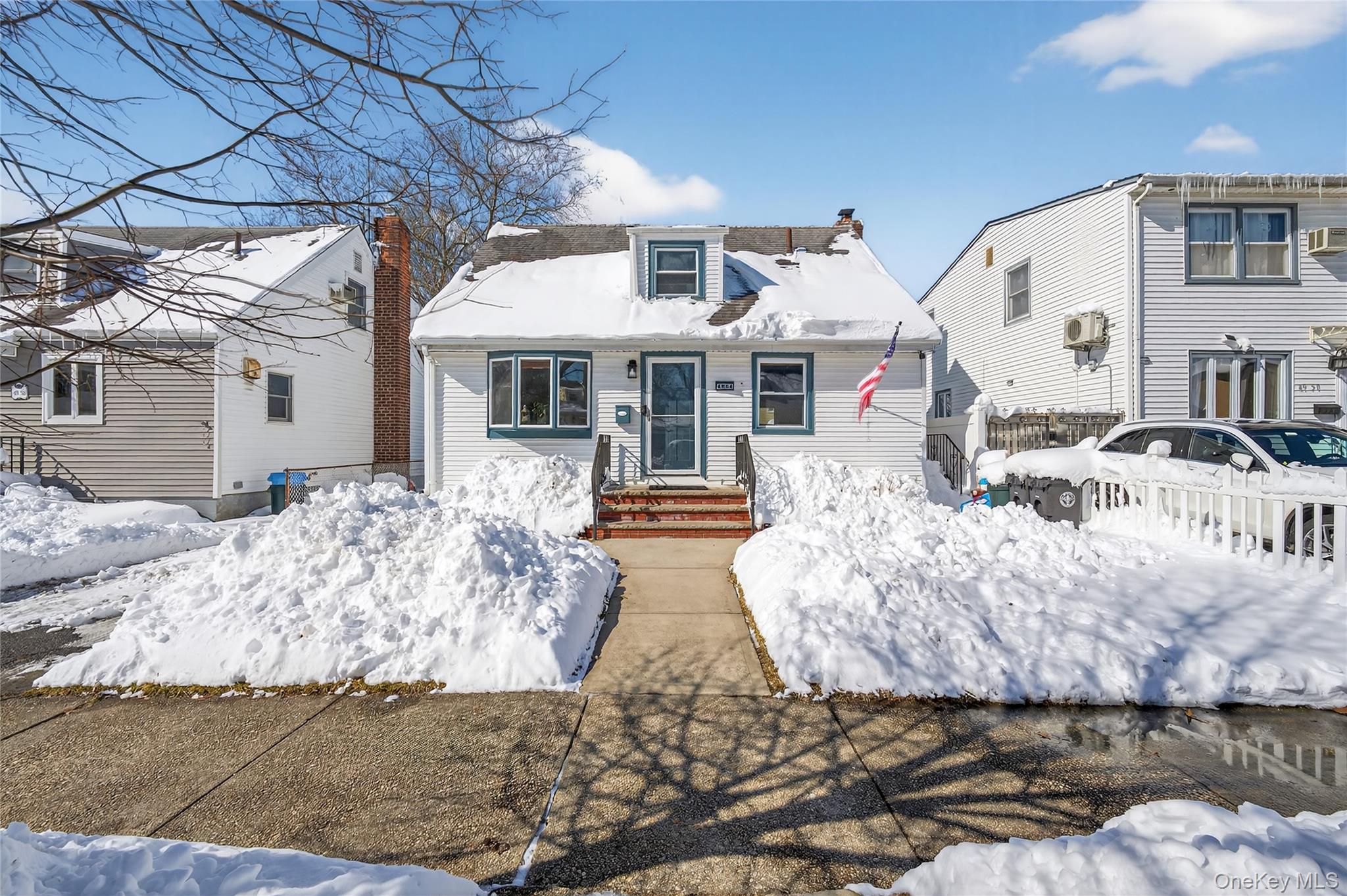 49-54 166th Street Queens, NY 11365 - Photo 7 of 41 a front view of a house with yard