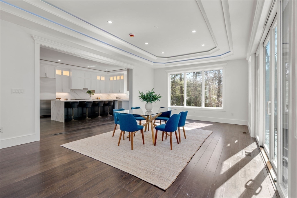 51 Plympton Road Sudbury, MA 01776 - Photo 13 of 38 a view of a dining room with furniture and chandelier
