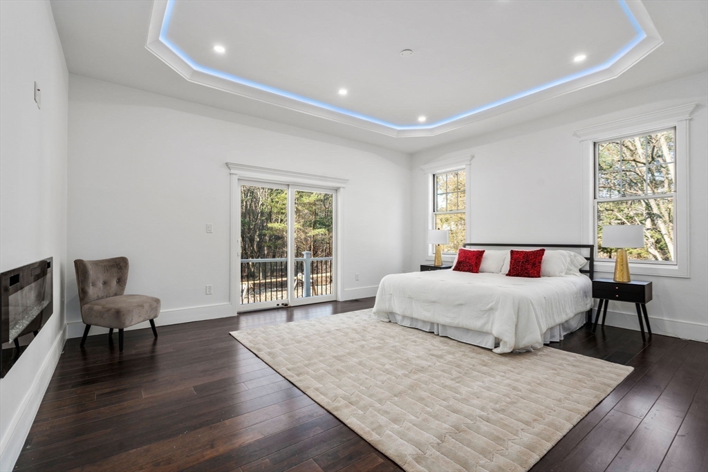 51 Plympton Road Sudbury, MA 01776 - Photo 16 of 38 a spacious bedroom with a bed and chair