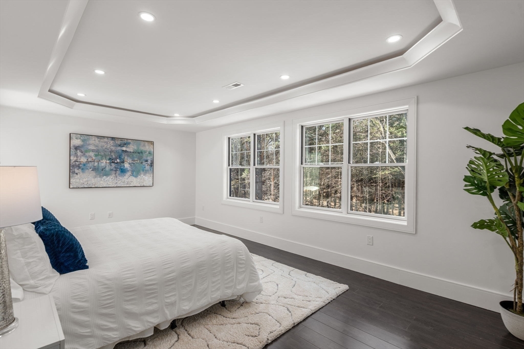 51 Plympton Road Sudbury, MA 01776 - Photo 21 of 38 a bedroom with a large bed and a window