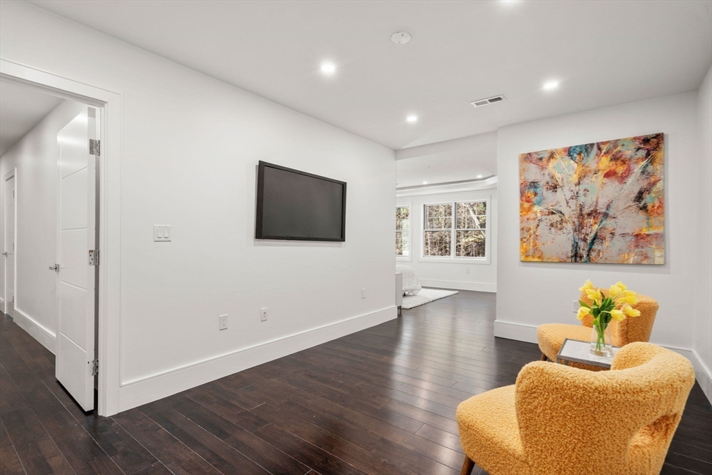 51 Plympton Road Sudbury, MA 01776 - Photo 22 of 38 a living room with furniture and a flat screen tv