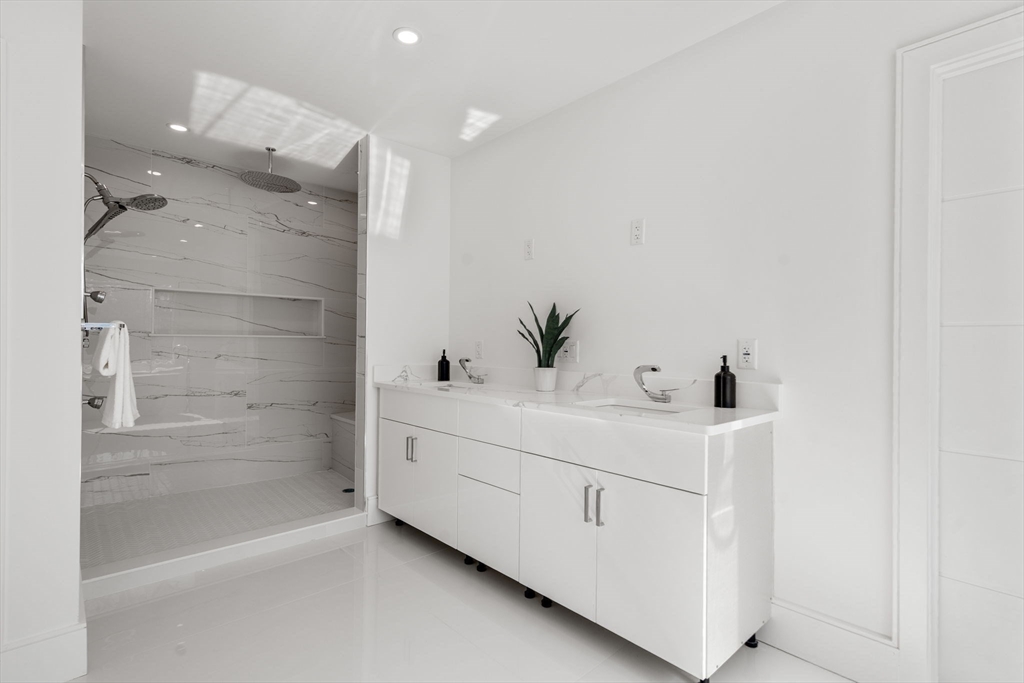 51 Plympton Road Sudbury, MA 01776 - Photo 24 of 38 a bathroom with a bathtub and a sink