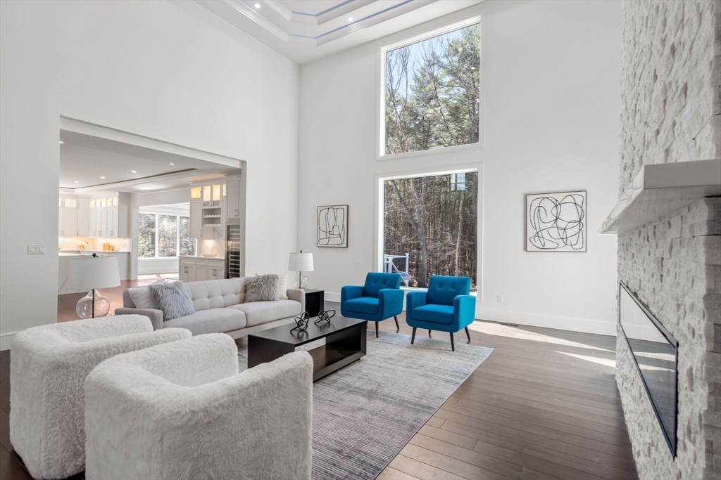 51 Plympton Road Sudbury, MA 01776 - Photo 3 of 38 a living room with furniture and a large window