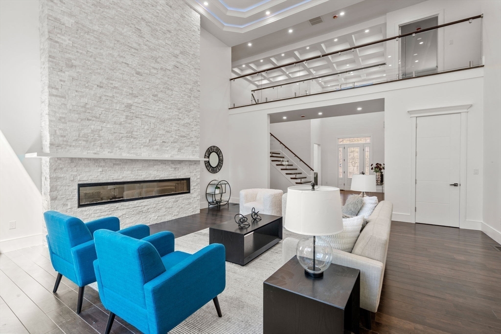 51 Plympton Road Sudbury, MA 01776 - Photo 4 of 38 a living room with furniture and a table