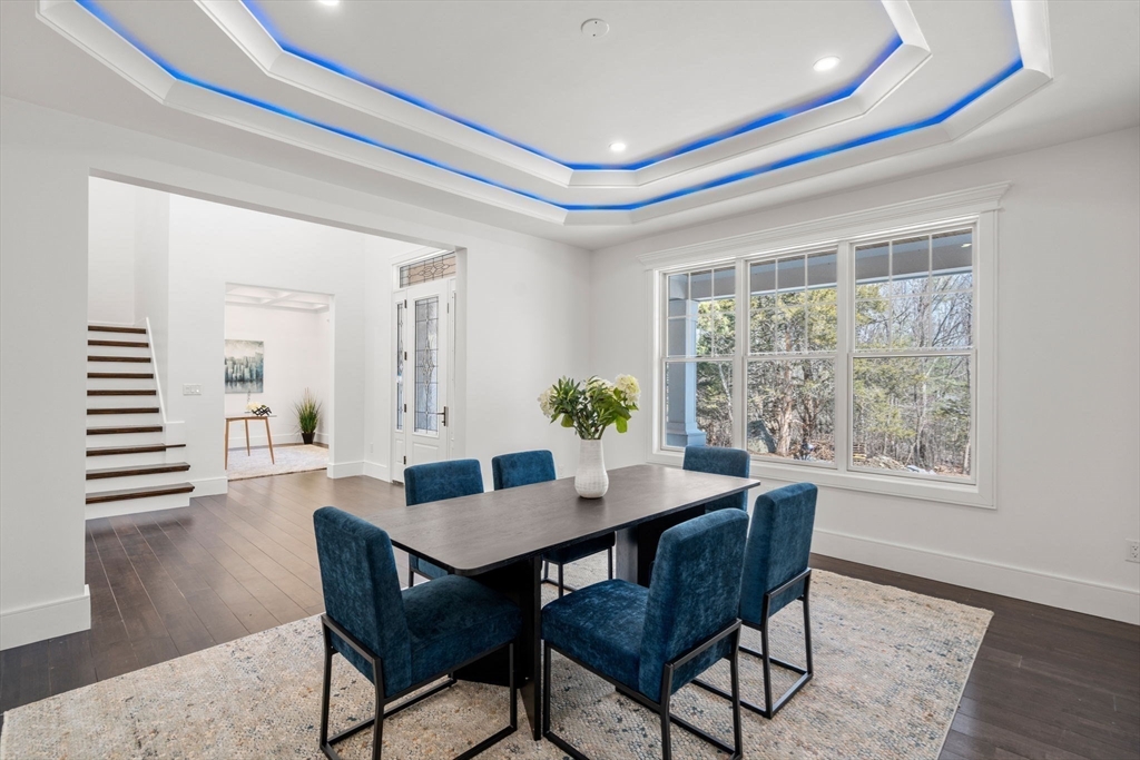51 Plympton Road Sudbury, MA 01776 - Photo 7 of 38 a dining room with furniture and wooden floor