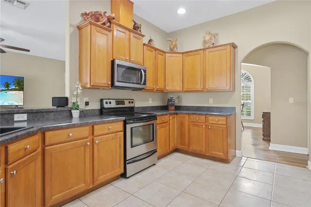 a kitchen with stainless steel appliances granite countertop a sink and cabinets
