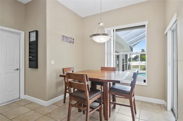 a view of a dining room with furniture and a window
