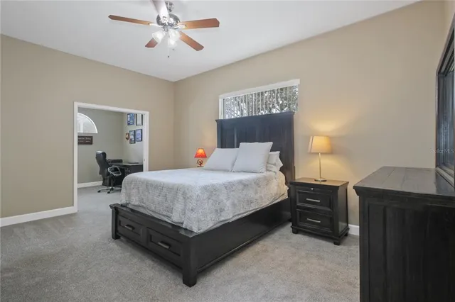 a bed room with a bed and a chandelier