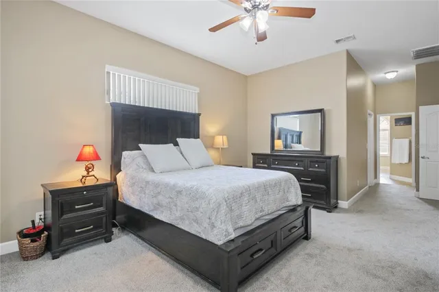 a bed room with a bed and a chandelier