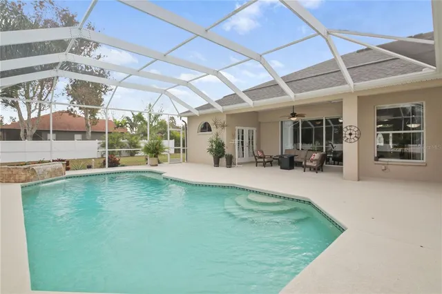a view of a swimming pool with a patio