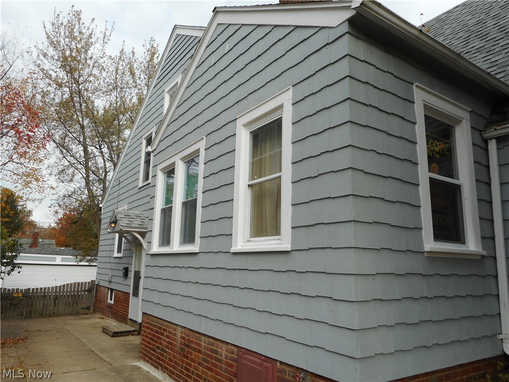 1150 Castleton Road Cleveland Heights, OH 44121 - Photo 22 of 25 Side view of this great house, new exterior paint this year! The fencing encloses the entire backyard!