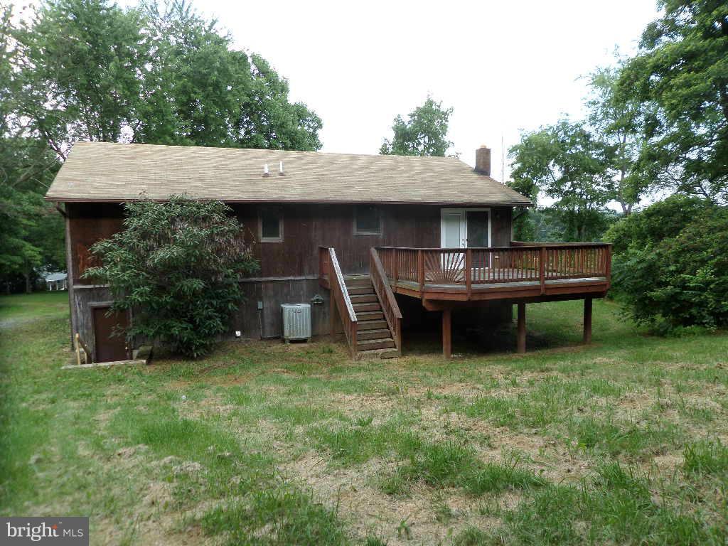 4242 Roop Road Mount Airy, MD 21771 - Photo 11 of 14 a backyard of a house with table and chairs