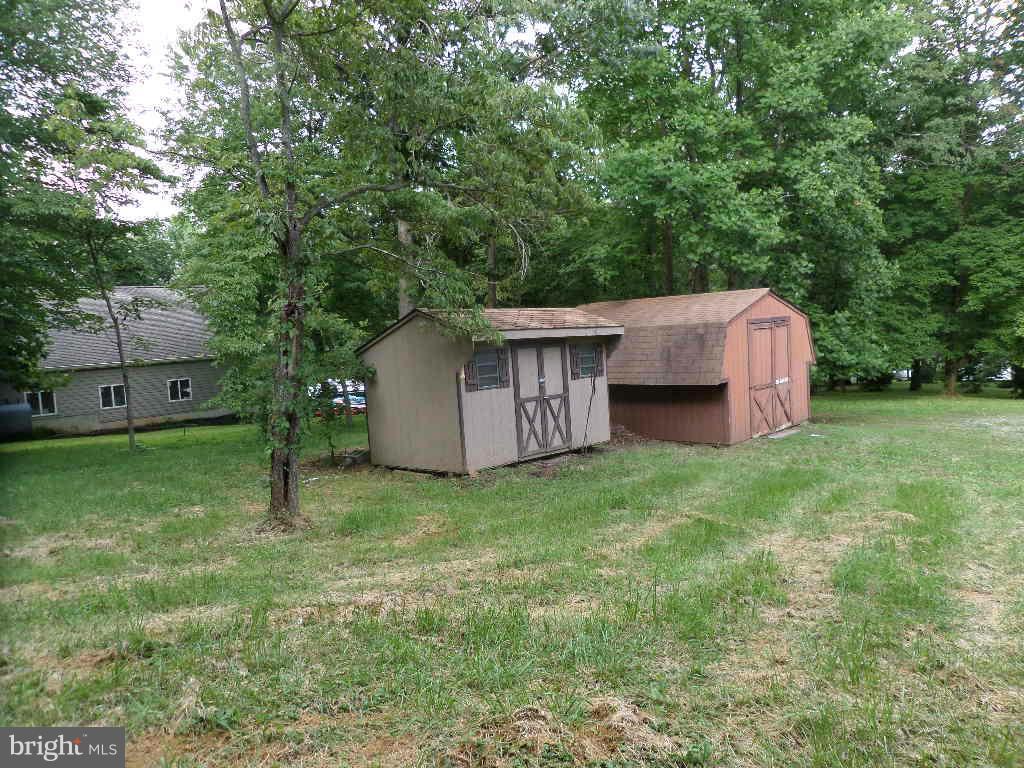 4242 Roop Road Mount Airy, MD 21771 - Photo 13 of 14 a backyard of a house with lots of green space
