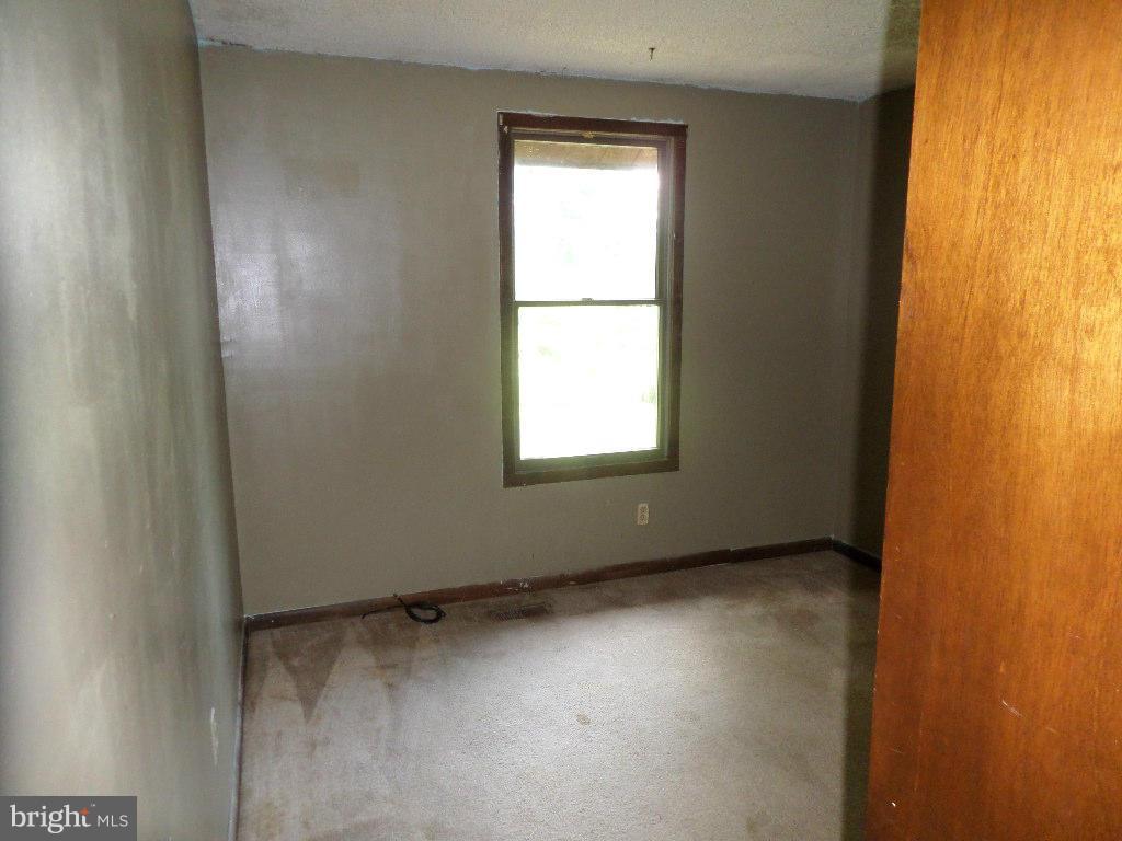 4242 Roop Road Mount Airy, MD 21771 - Photo 4 of 14 an empty room with a window