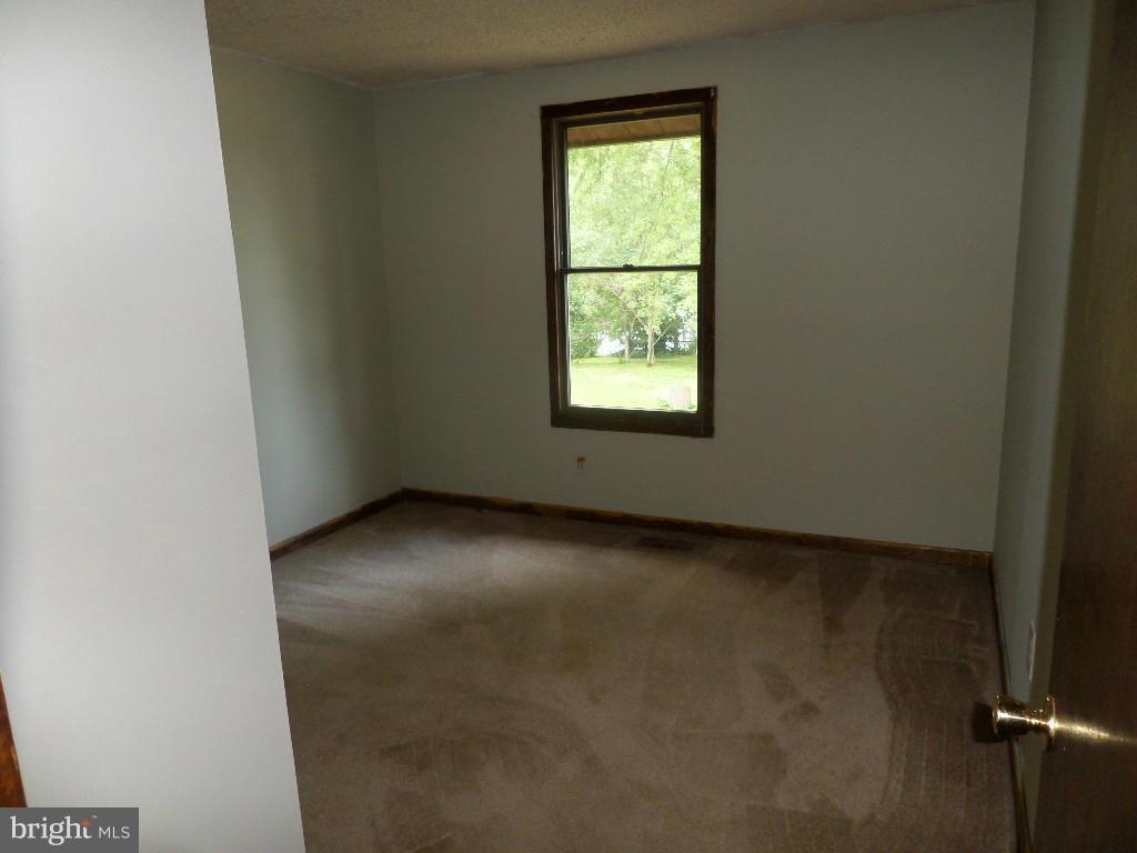 4242 Roop Road Mount Airy, MD 21771 - Photo 5 of 14 an empty room with a window