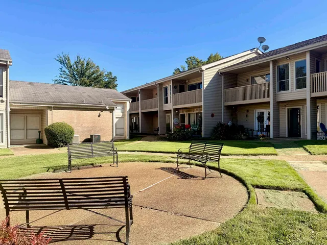 a view of a building with a swimming pool