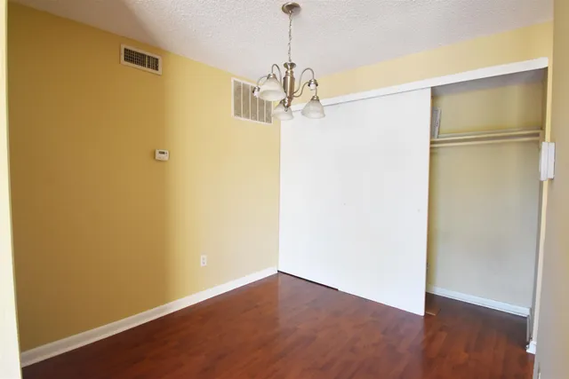 a view of a refrigerator in a kitchen