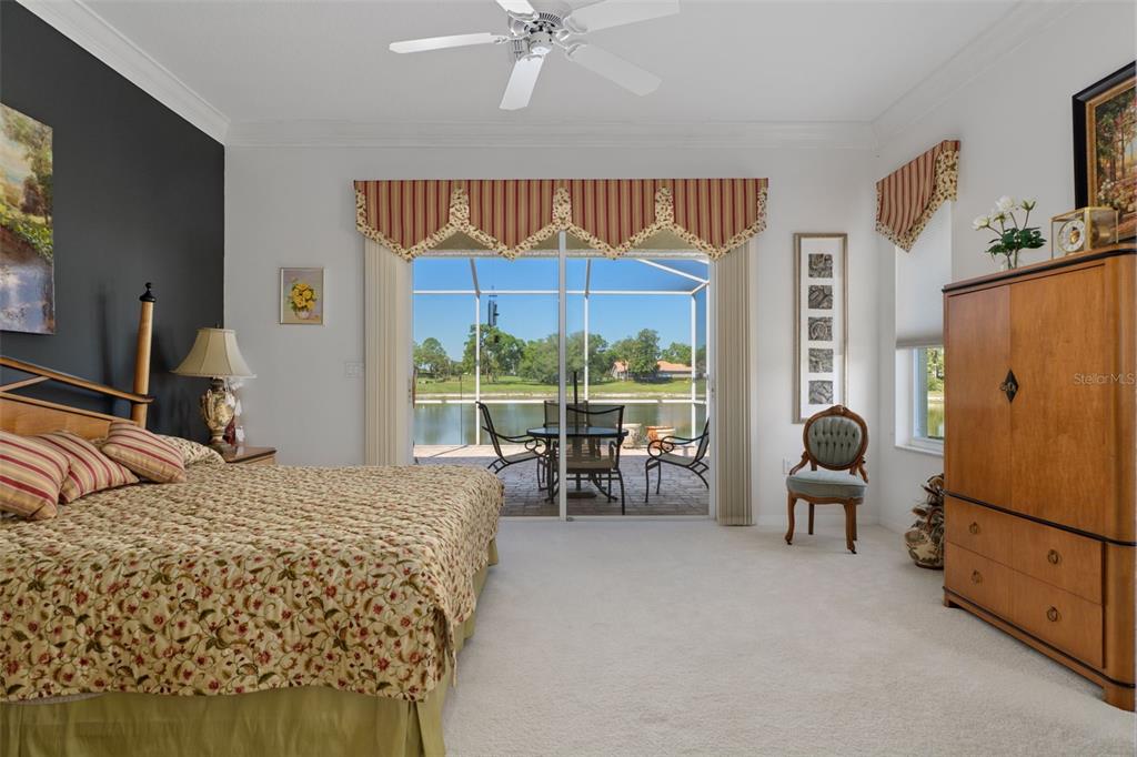 10081 Georgetown Court Weeki Wachee, FL 34613 - Photo 23 of 76 a bedroom with a bed and a large window