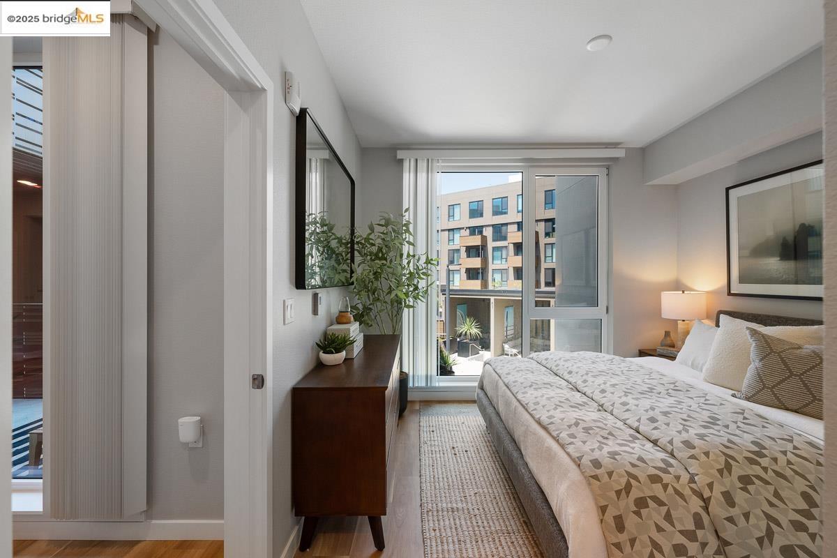 260 Brooklyn Basin Way, Unit 417 Oakland, CA 94606 - Photo 12 of 48 Bedroom featuring wood finished floors and baseboards