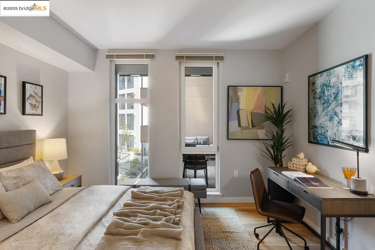 260 Brooklyn Basin Way, Unit 417 Oakland, CA 94606 - Photo 20 of 48 Bedroom featuring wood finished floors and an office area