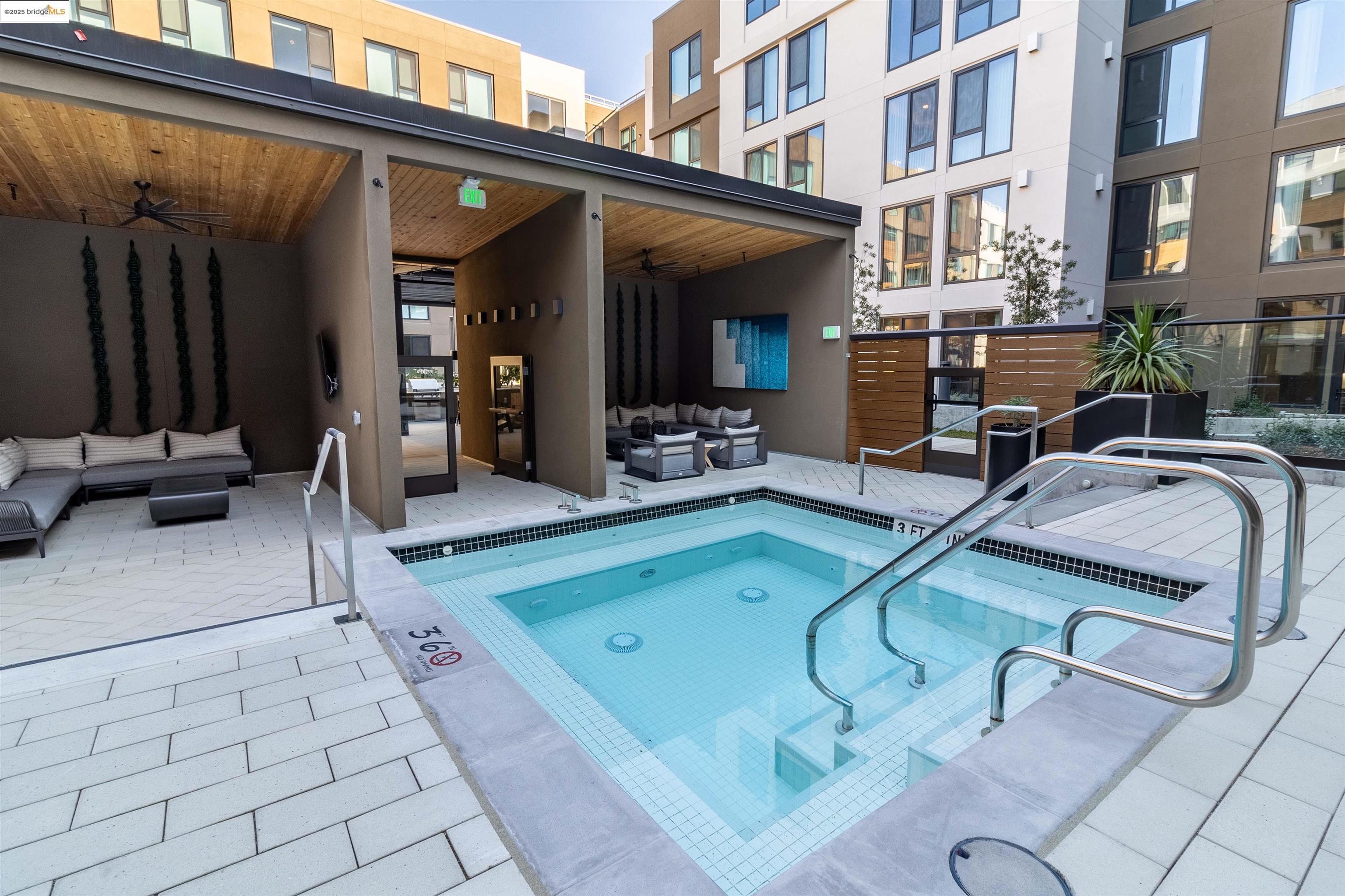 260 Brooklyn Basin Way, Unit 417 Oakland, CA 94606 - Photo 36 of 48 View of pool with outdoor lounge area, ceiling fan, a swimming pool, a patio area, and a hot tub