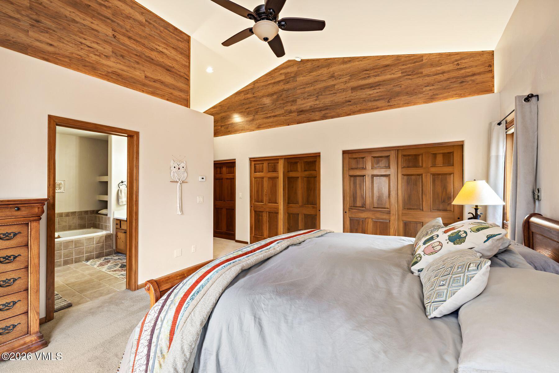 91 Creamery Trail Edwards, CO 81632 - Photo 19 of 44 a view of a bedroom with a bed and wooden floor