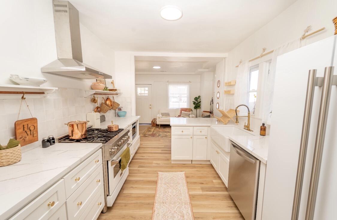 232 Ash Street Exeter, CA 93221 - Photo 8 of 13 a large kitchen with a lot of counter space