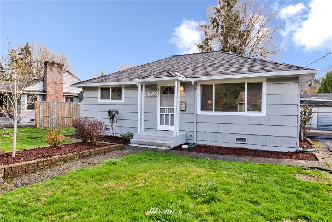 3309 Southeast 5th Street Renton, WA 98058 - Photo 2 of 23 a view of a house with a yard