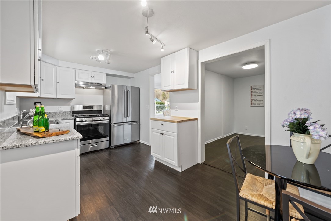 3309 Southeast 5th Street Renton, WA 98058 - Photo 13 of 23 a kitchen with a sink appliances and cabinets