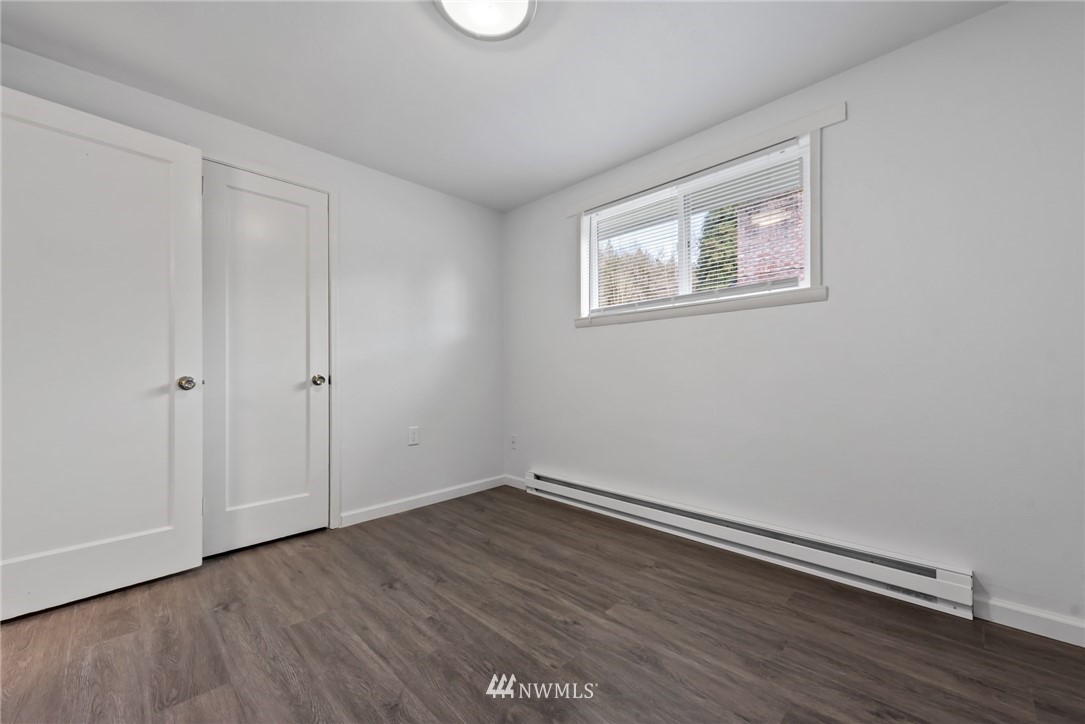 3309 Southeast 5th Street Renton, WA 98058 - Photo 17 of 23 a view of an empty room with wooden floor