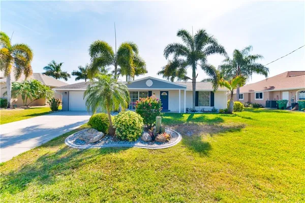 a front view of a house with swimming pool having outdoor seating