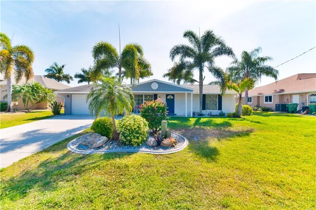 a front view of a house with swimming pool having outdoor seating