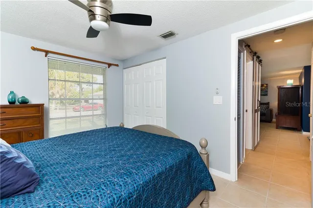 a bedroom with a bed and a television