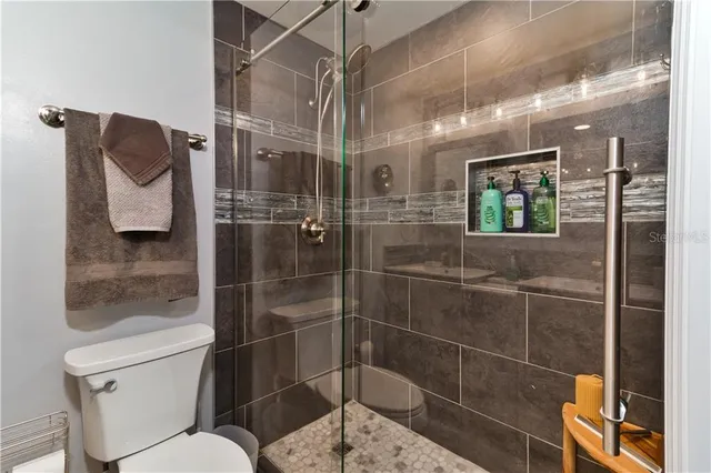 a view of a patio with couches and pool