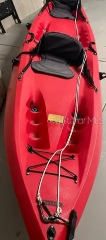 a swimming pool with barbeque oven and outdoor seating