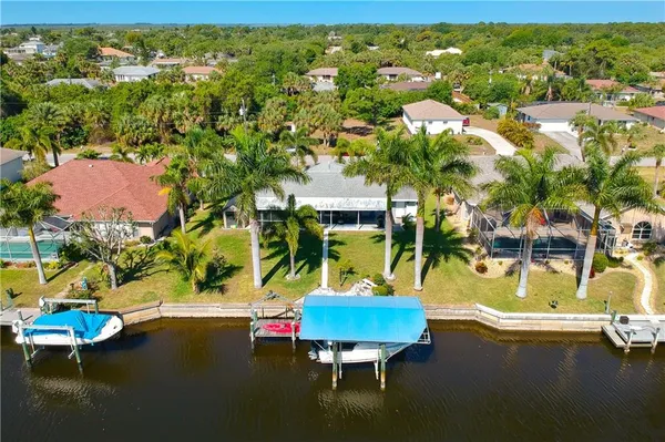 a view of a swimming pool with a yard