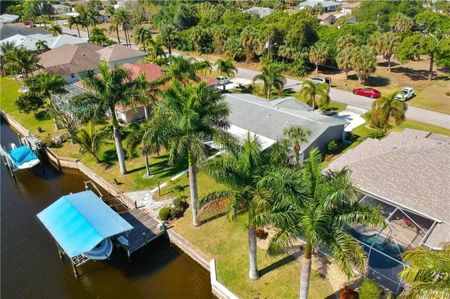 an aerial view of a house with a swimming pool