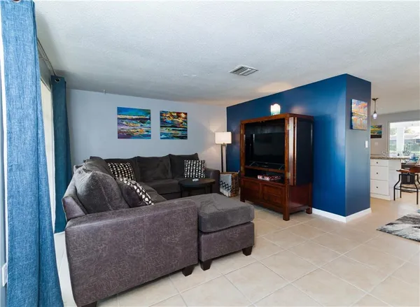 a kitchen with stainless steel appliances granite countertop a refrigerator stove and sink