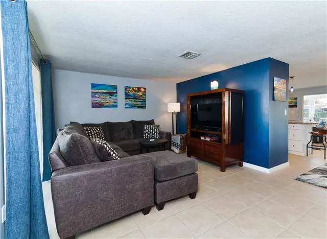 a kitchen with stainless steel appliances granite countertop a refrigerator stove and sink