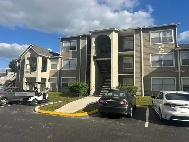 a view of a car park in front of a building