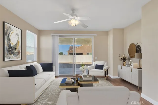 a living room with furniture and view of large window