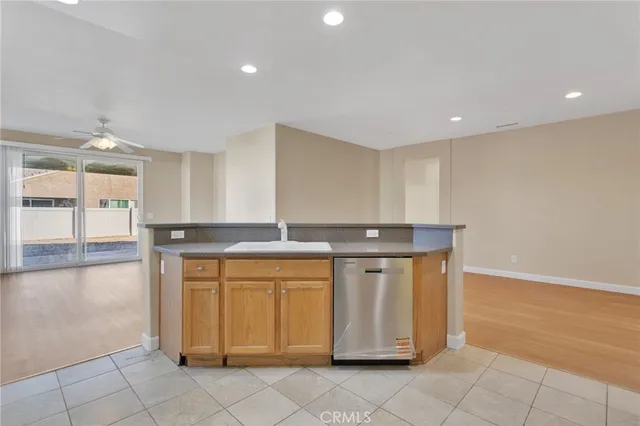 a kitchen with stainless steel appliances granite countertop a sink and cabinets
