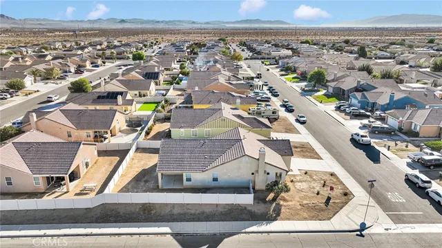 a view of backyard and garage