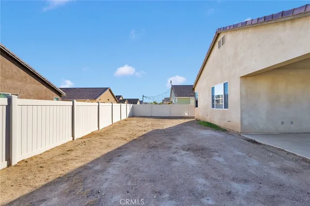 a view of a house with backyard and garage