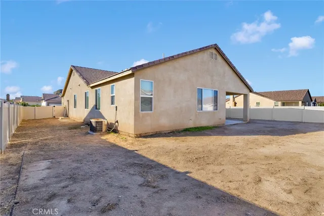 a view of a backyard of the house